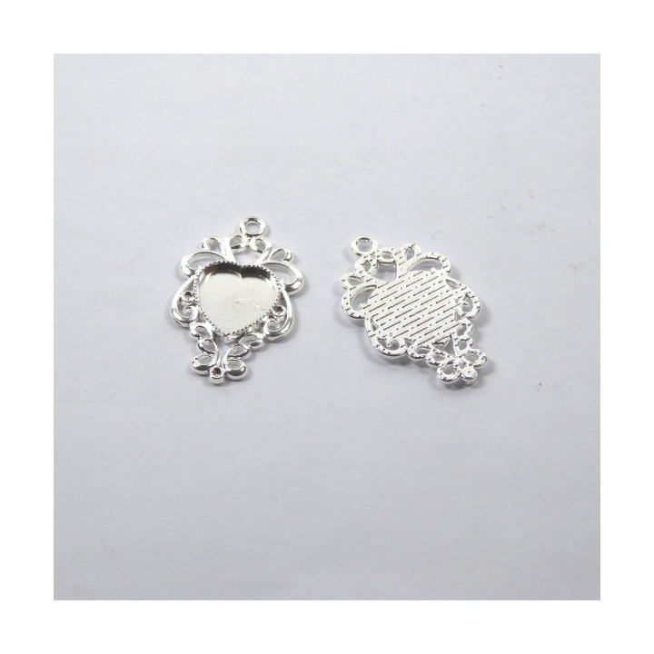 MEDAGLIA IN ZAMA ARGENTATA 28x22x2mm - interno 10x11mm