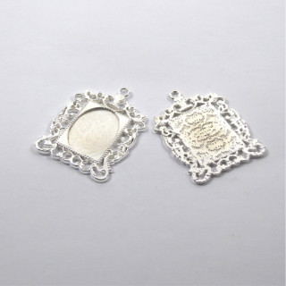 MEDAGLIA IN ZAMA ARGENTATA 33x46x2mm - interno 18x25mm