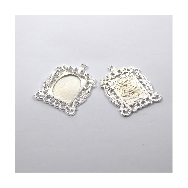 MEDAGLIA IN ZAMA ARGENTATA 33x46x2mm - interno 18x25mm